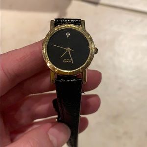 Black leather gold Avon watch